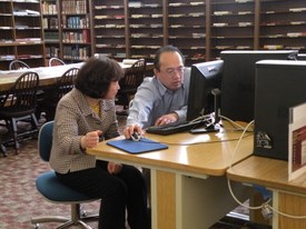 2011 Michael at reading room computer with a patron