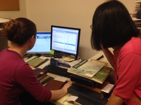 2014 Emily and Charlene working on cataloging