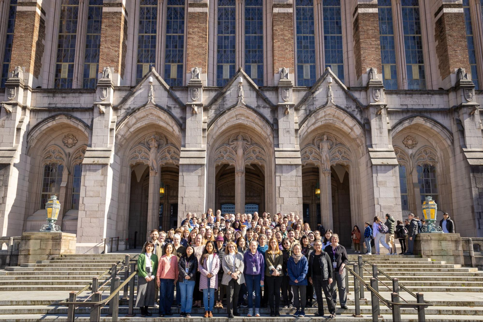 Staff group photo in front of the library