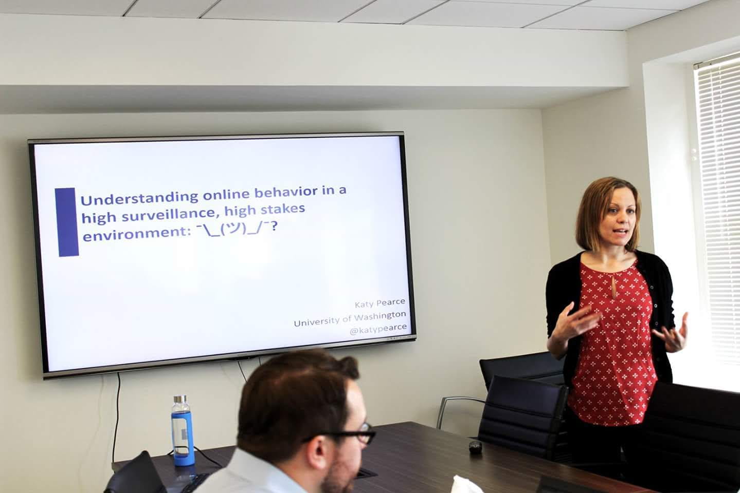 Katy Pearce giving a presentation titled "Understanding online behavior in a high surveillance, high stakes environment"