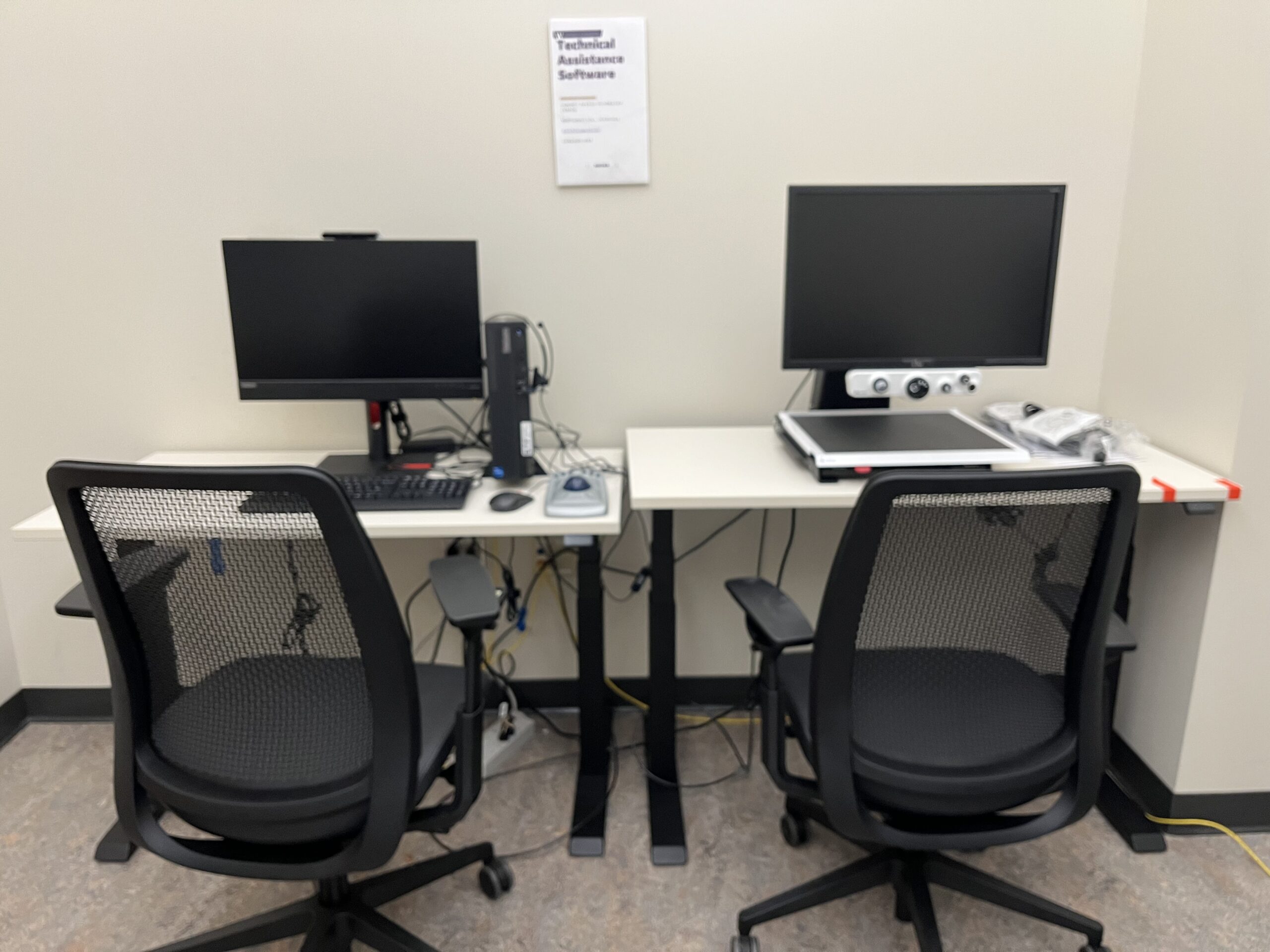 2 desks with accessible computers on them