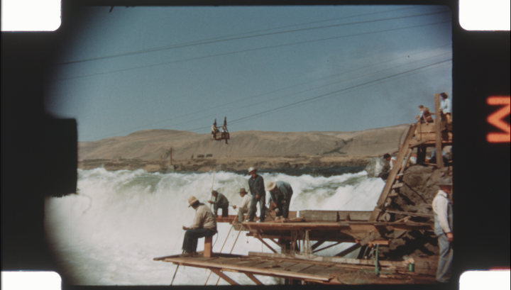 Moving image film frame showing people fishing at Celilo Falls from the Conrad DeLateur family films, 1933-1964