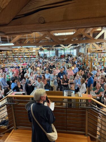 Nicole Miller, Director, University of Washington Press, addressing the 300+ guests at the University Press Happy Hour at Elliott Bay Book Co.