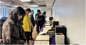 Students and faculty viewing special collections in the exhibit, Exploring East Asia’s Cultural Heritage Through Illustrated Works